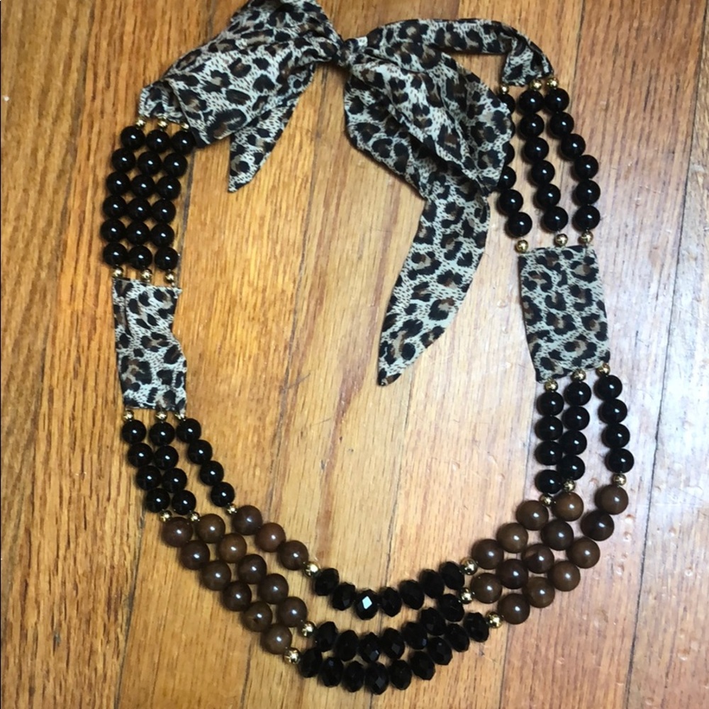 Layered beaded bow tie necklace